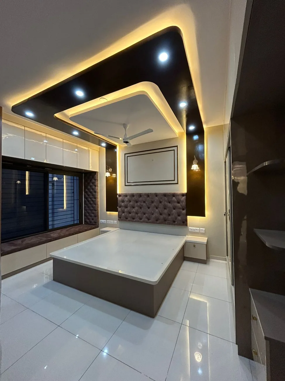 A warm, finished Niviya Interiors living space with a window seat