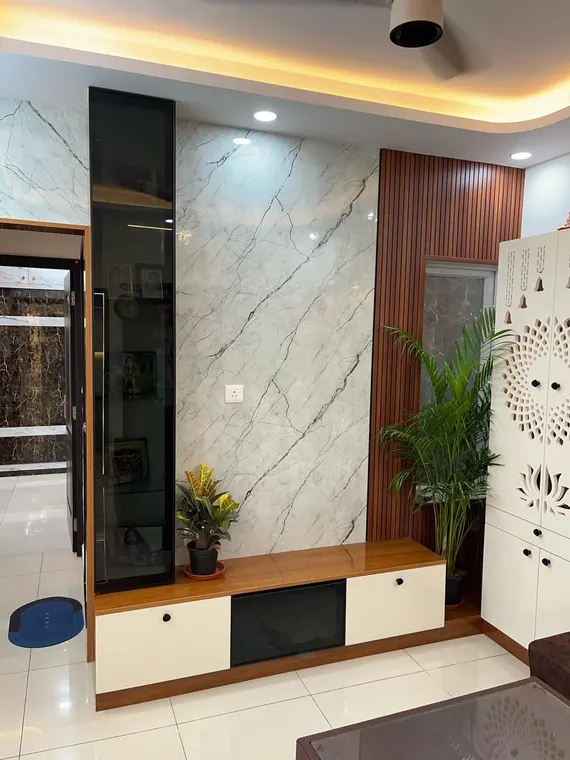 Foyer feature wall in marble with a floating wood ledge