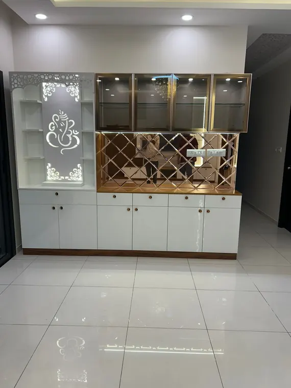 Ivory and gold lattice pooja unit with etched glass